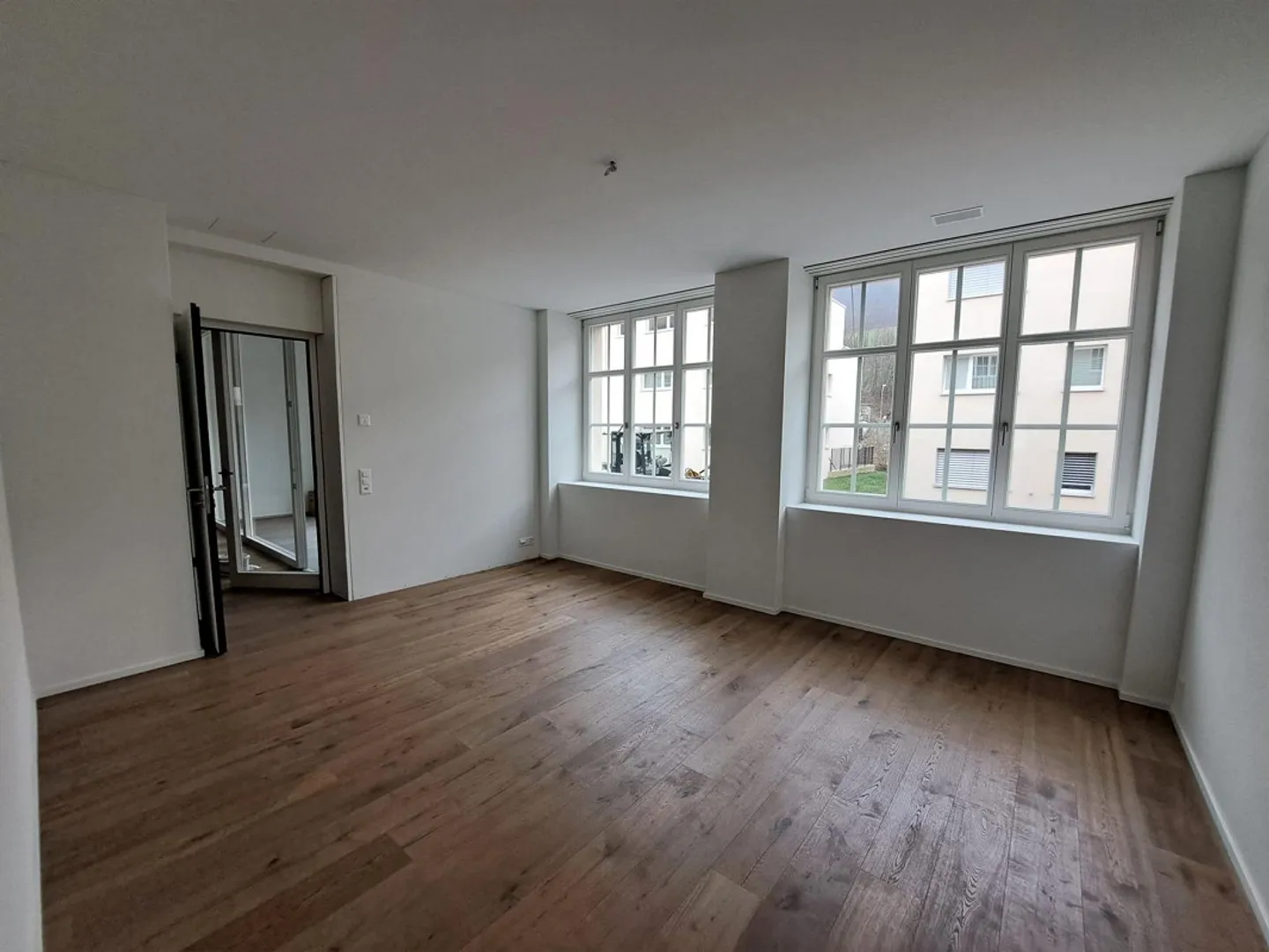 Appartement de 2.5 pièces avec loggia, coin jardin et garage - Photo 7 sur 13