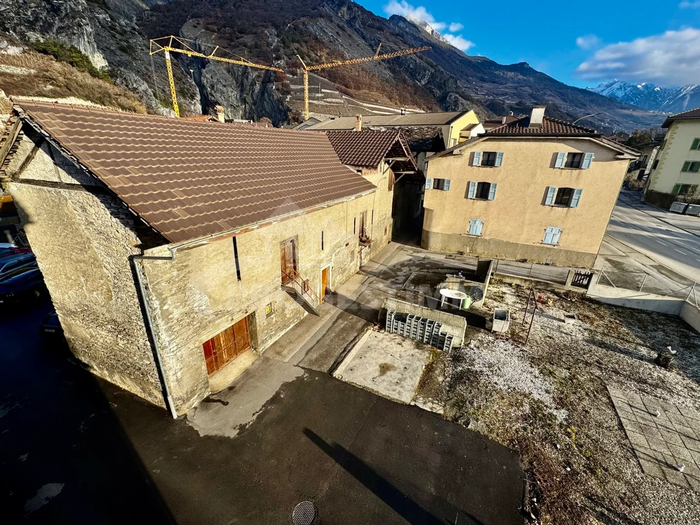 BUILDING WITH HIGH POTENTIAL - TWO APARTMENTS AND CONVERTIBLE BARNS - Photo 1 of 13