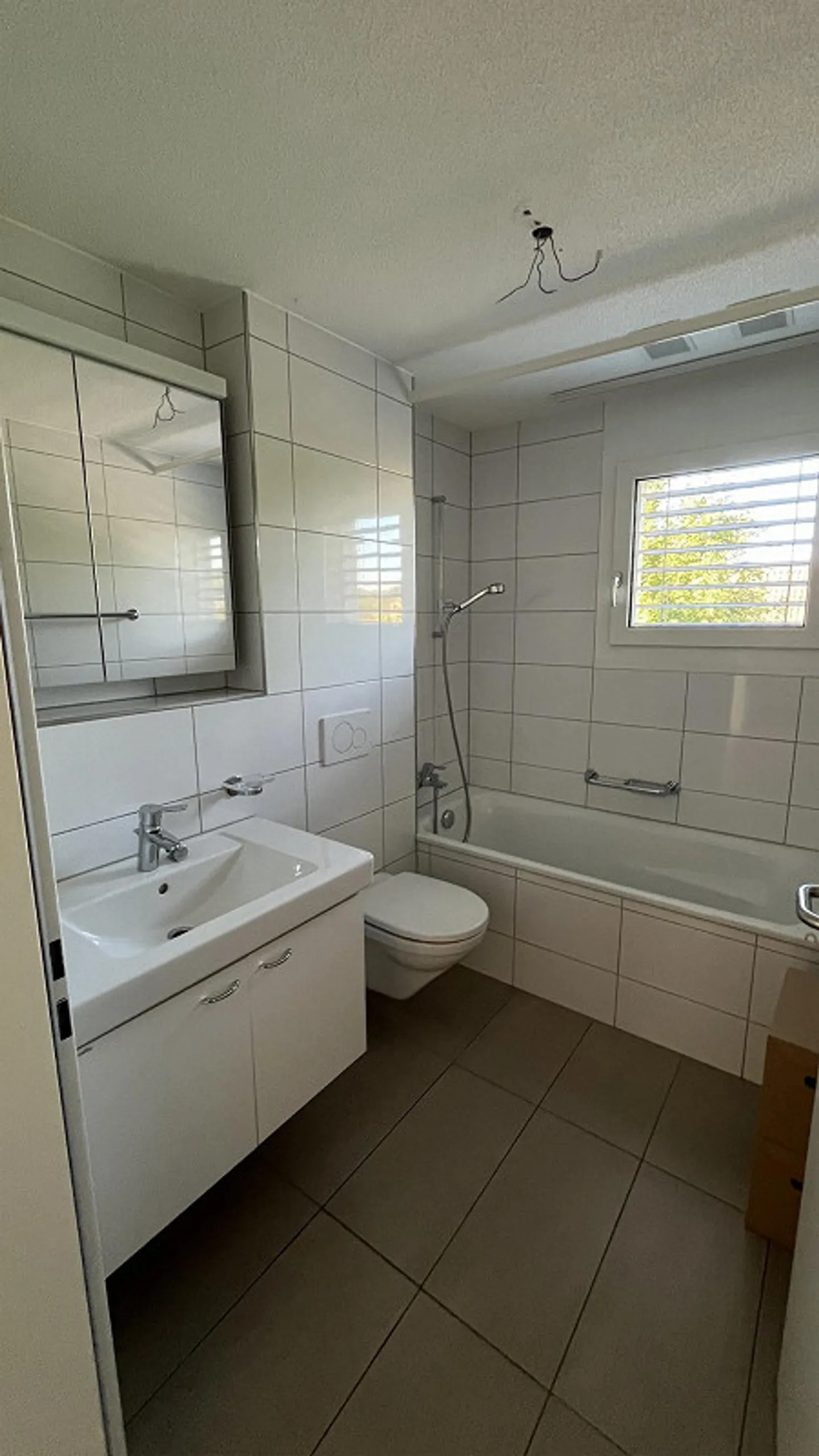 Appartement 4.5 pièces avec place de parking extérieure et souterraine avec station de recharge - Photo 7 sur 13
