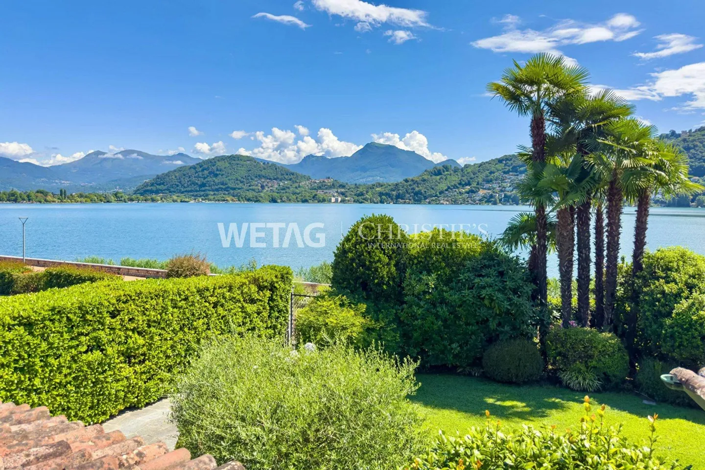 Elegant villa with pool in Lugano-Magliaso for sale, located directly on Lake Lugano - Photo 2 of 13