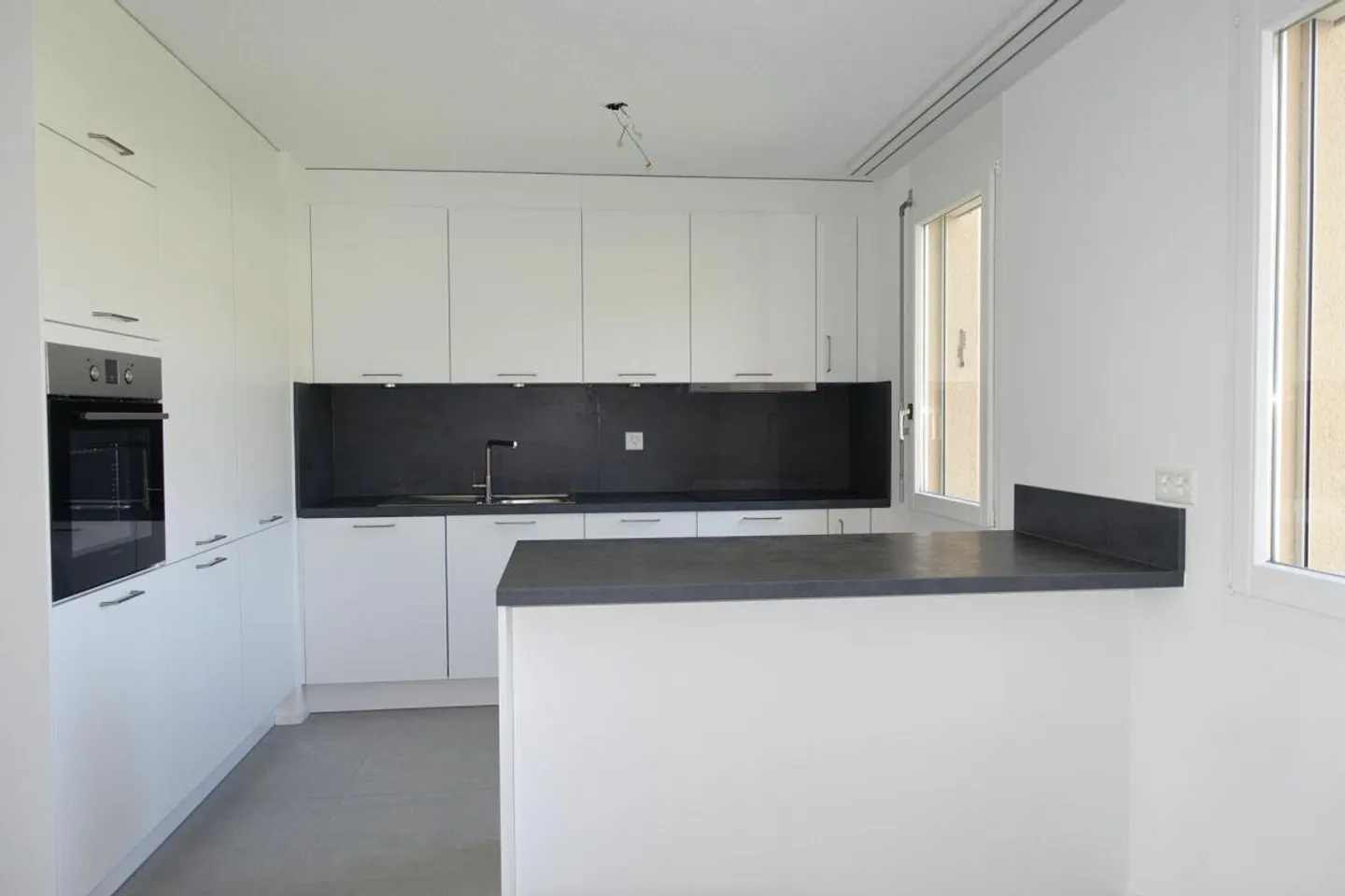 Appartement en copropriété de 3,5 pièces avec balcon et place de parking - Photo 4 sur 21