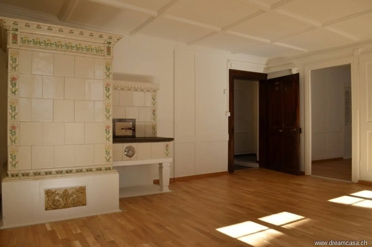 Charming Living with Cozy Tiled Stove - Photo 1 of 10