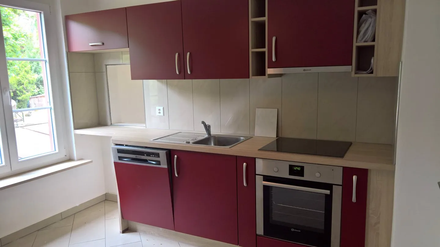 Wohnung im 1. Stock mit überdachtem Parkplatz - Foto 6 von 16