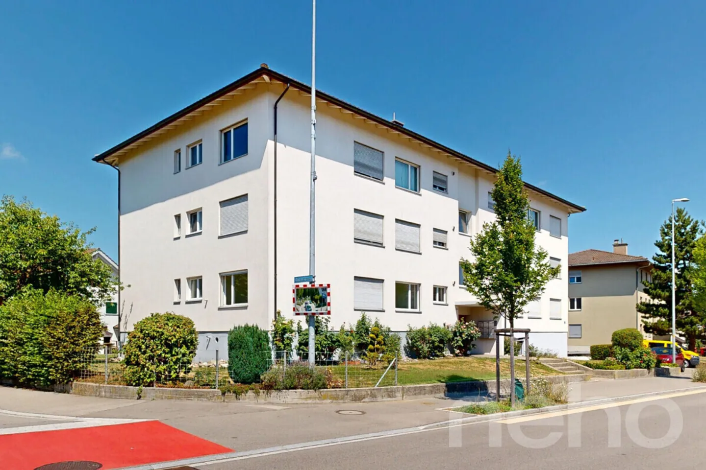 Maison multifamiliale bien entretenue avec 9 appartements à Schwarzenbach SG - Photo 1 sur 12