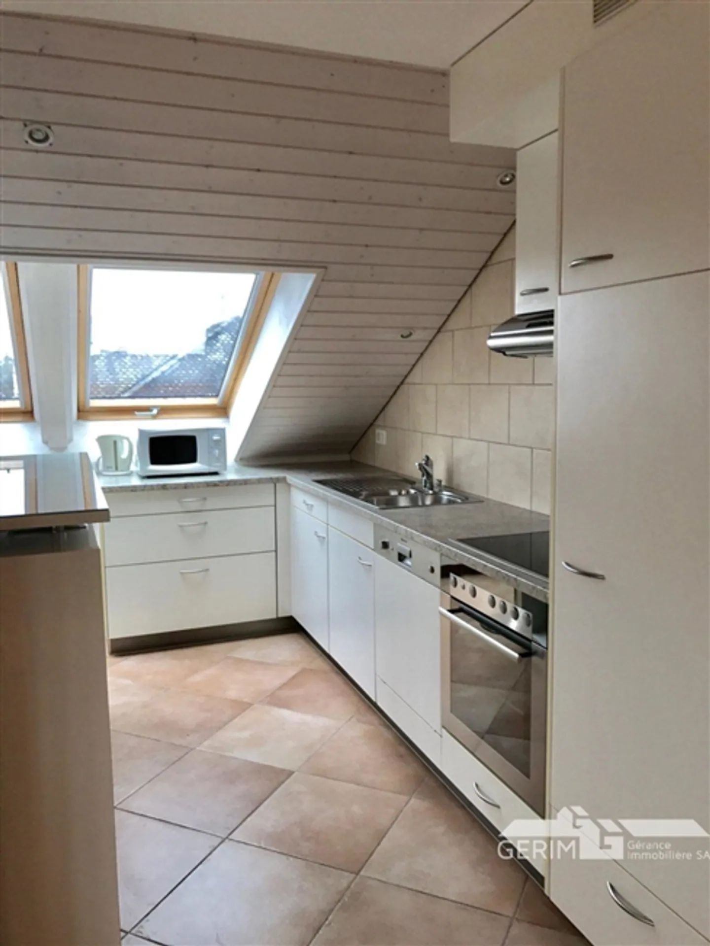 APPARTEMENT MEUBLÉ DANS LE QUARTIER DE CHAILLY AVEC VUE SUR LE LAC - Photo 4 sur 13