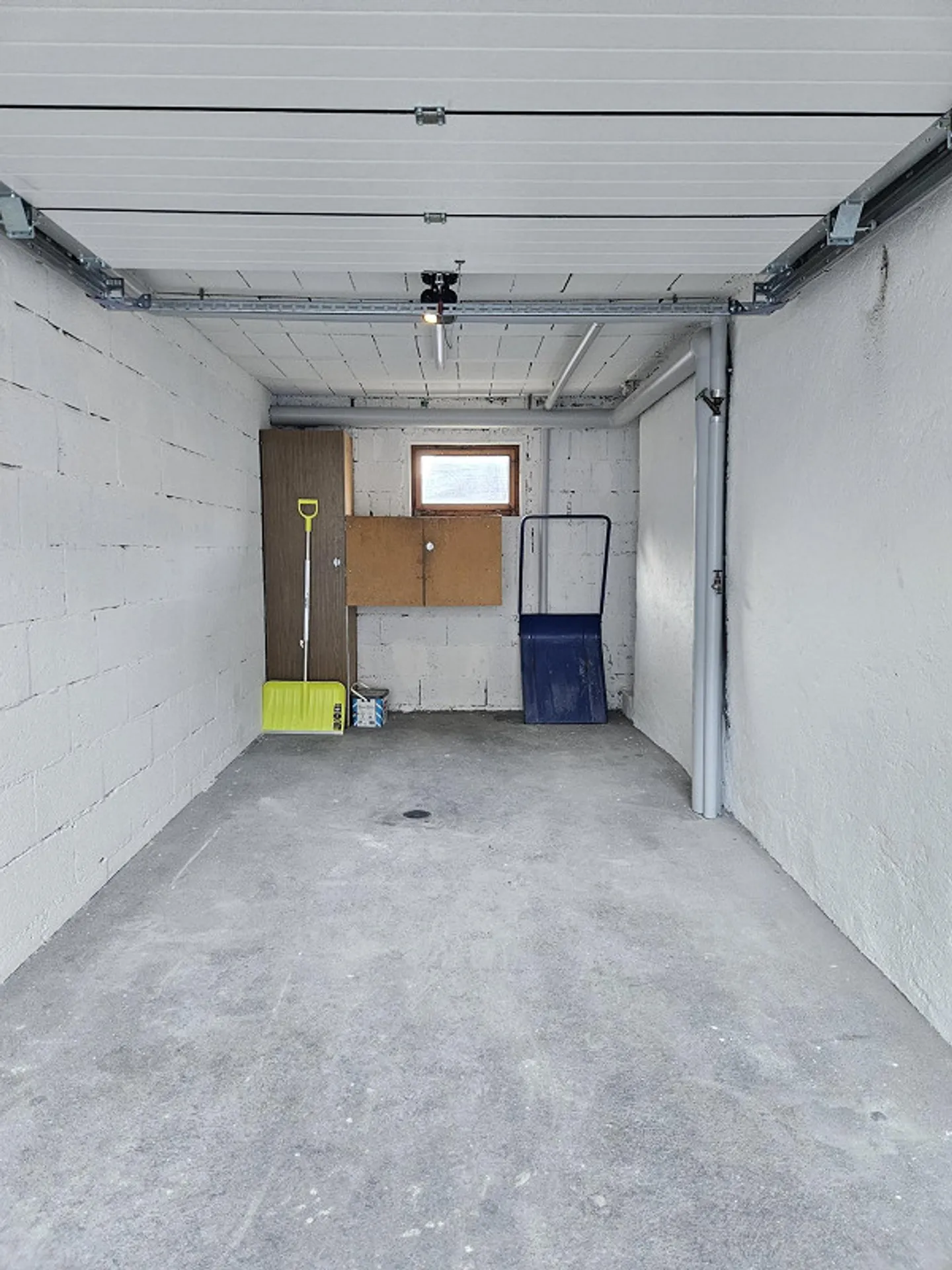 Spacious Garage with Window - Photo 3 of 4