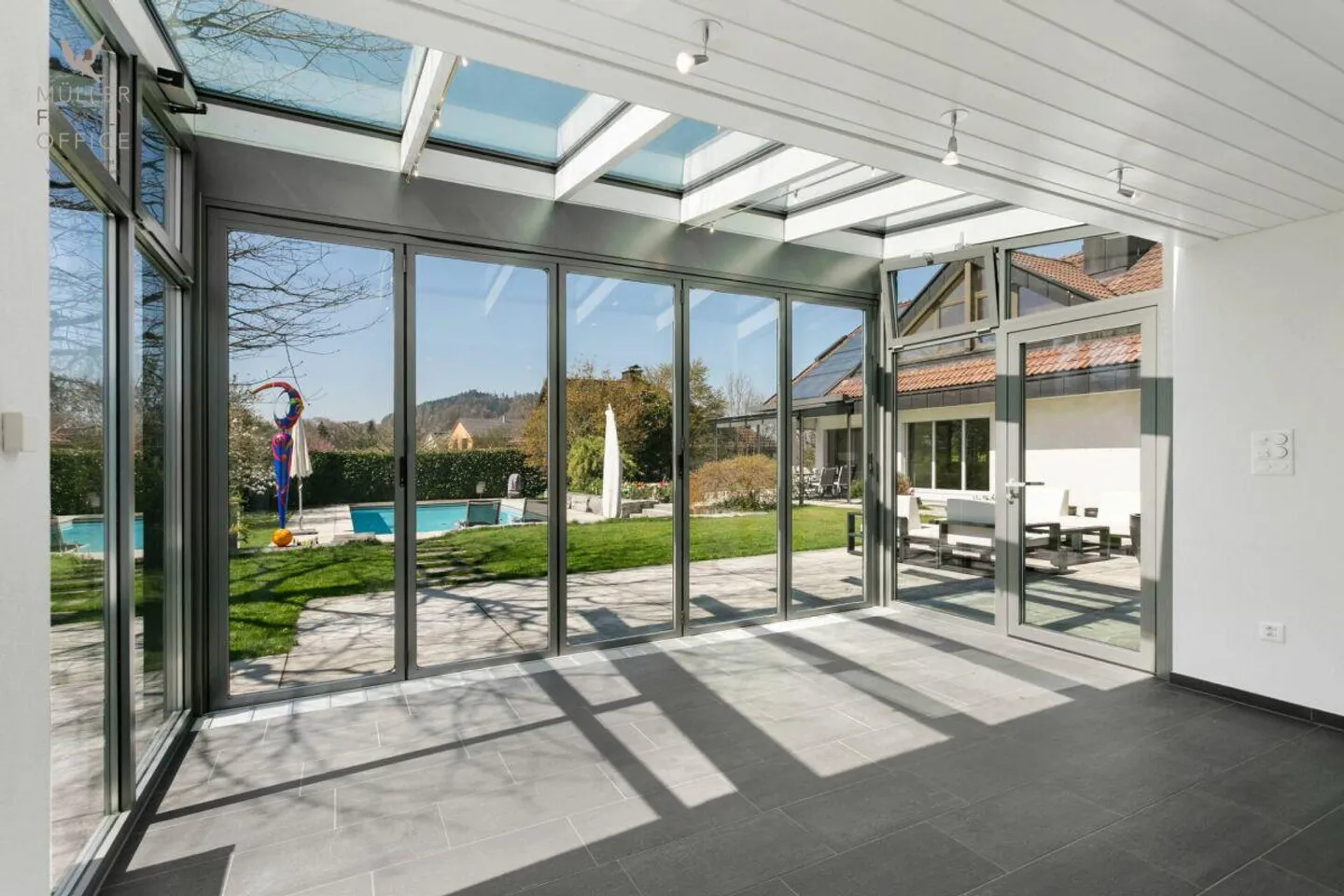 Elegant Single-Family Home with Dreamlike Garden and Pool Oasis - Photo 8 of 13