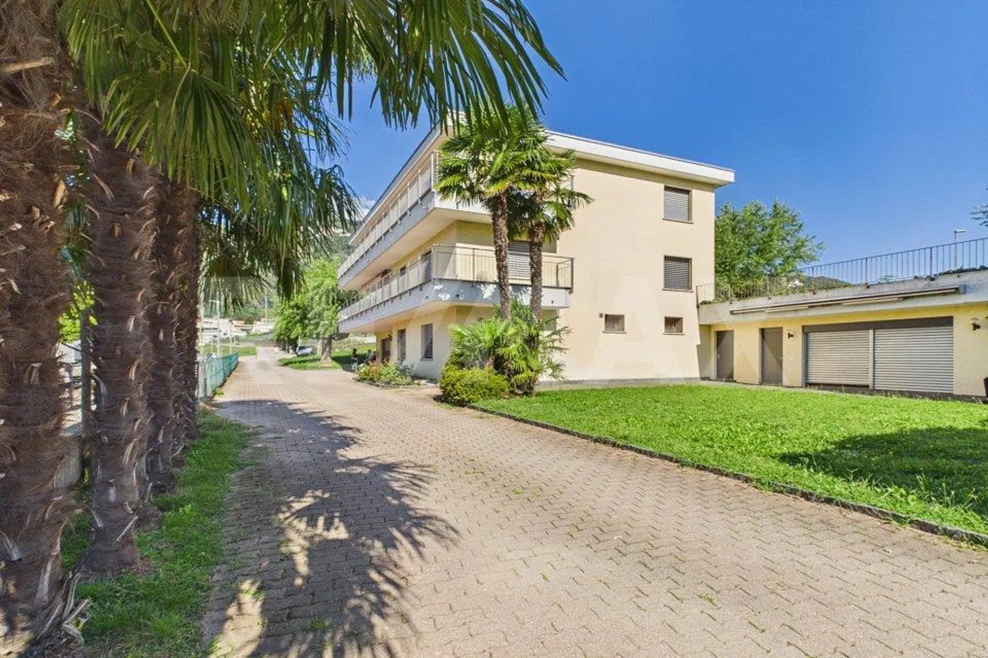 Versatile property with profitability and development potential in Bioggio - Photo 1 of 13