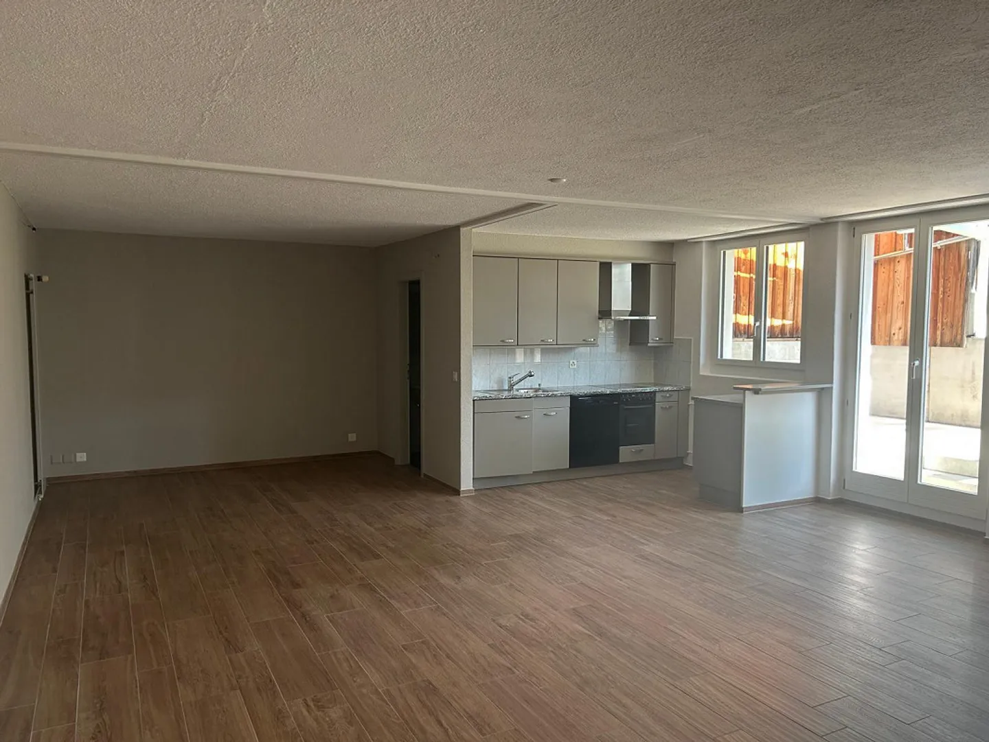 Appartamento 1,5 locali (UG) con terrazza giardino e padiglione in vetro - Foto 1 di 11