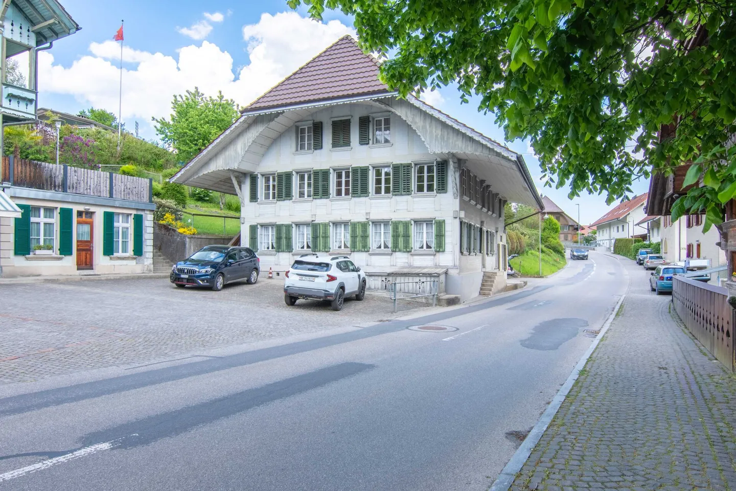 Former school building from 1805 at the village square - with three apartments, studio and expansion potential! - Photo 1 of 23