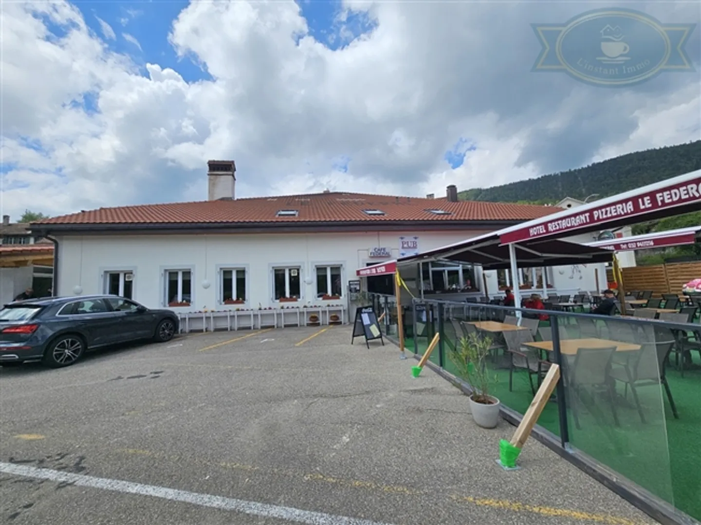 «Voll vermietetes Mischgebäude im Dorfzentrum von Villeret» - Foto 1 von 12