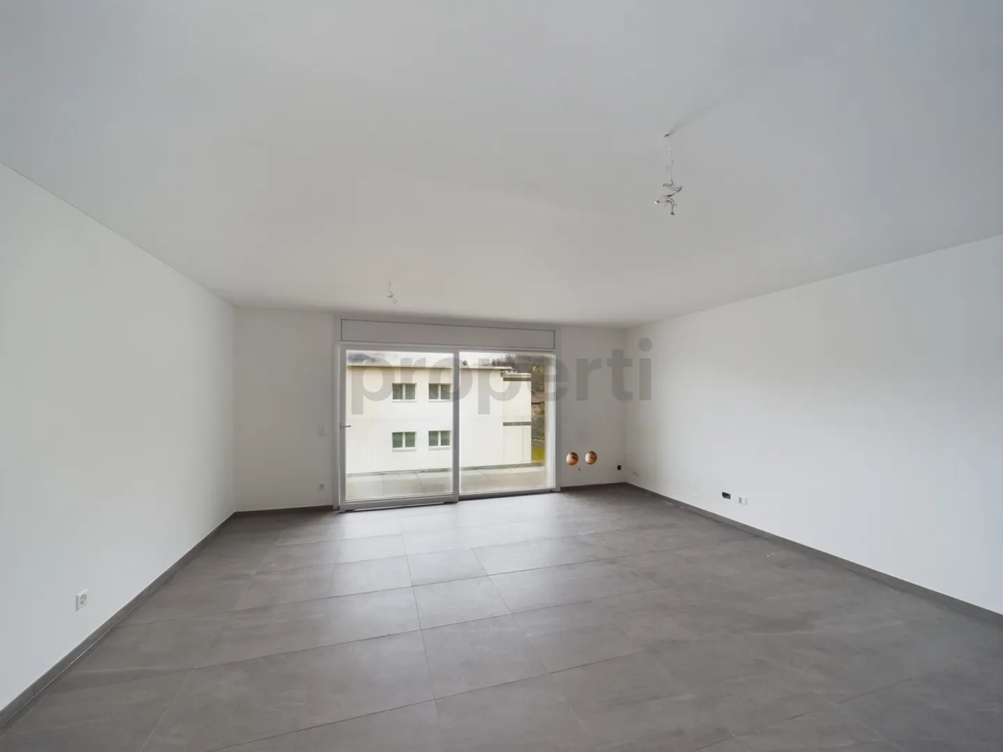 Modernes 3,5-Zimmer-Apartment in Caslano - Foto 1 von 11