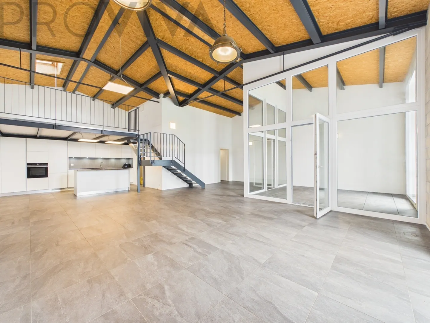 Appartement Loft Moderne avec Galerie à Gampelen - Photo 4 sur 8
