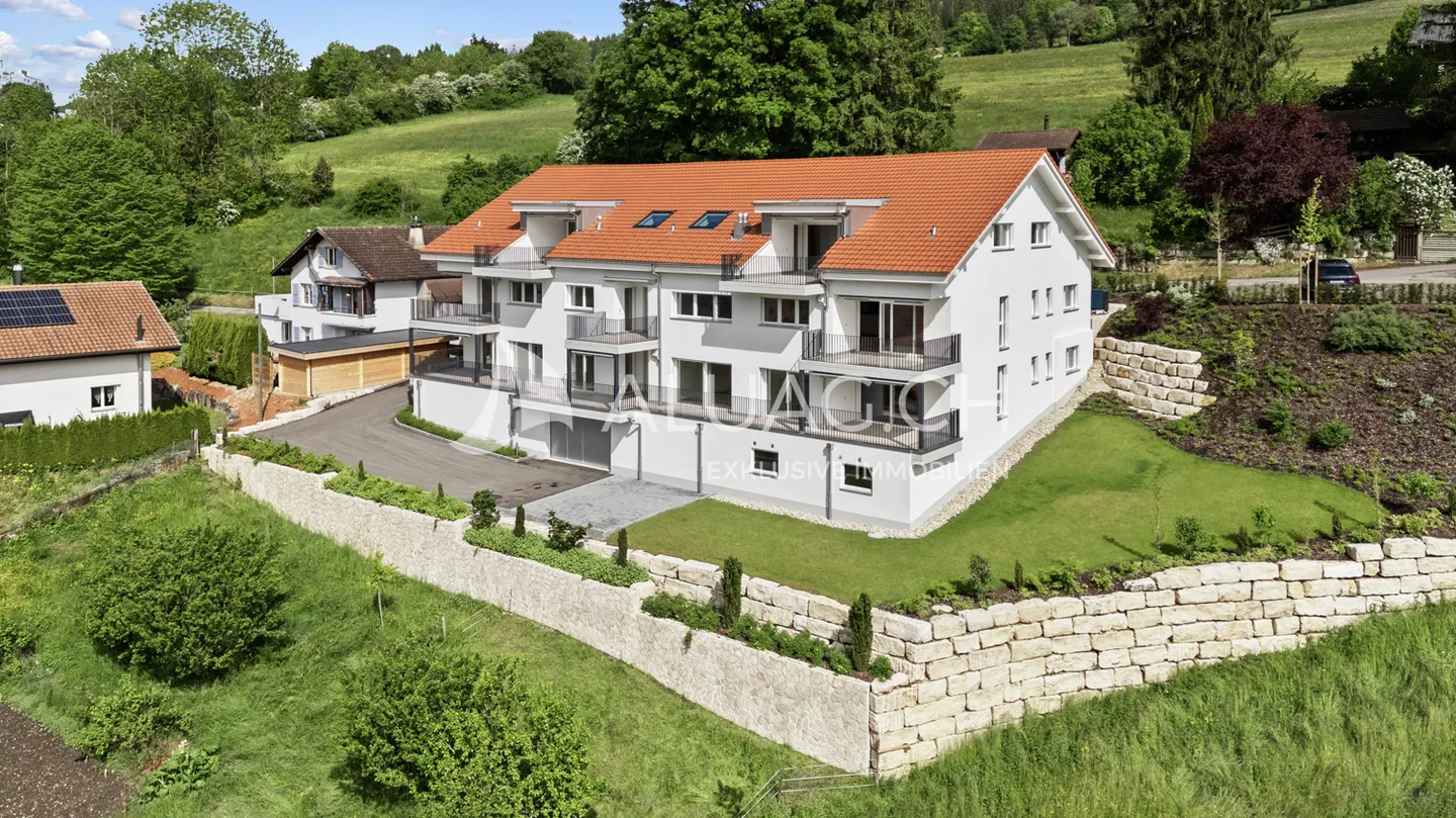 Modernes Mehrfamilienhaus in Tramelan - Foto 1 von 17