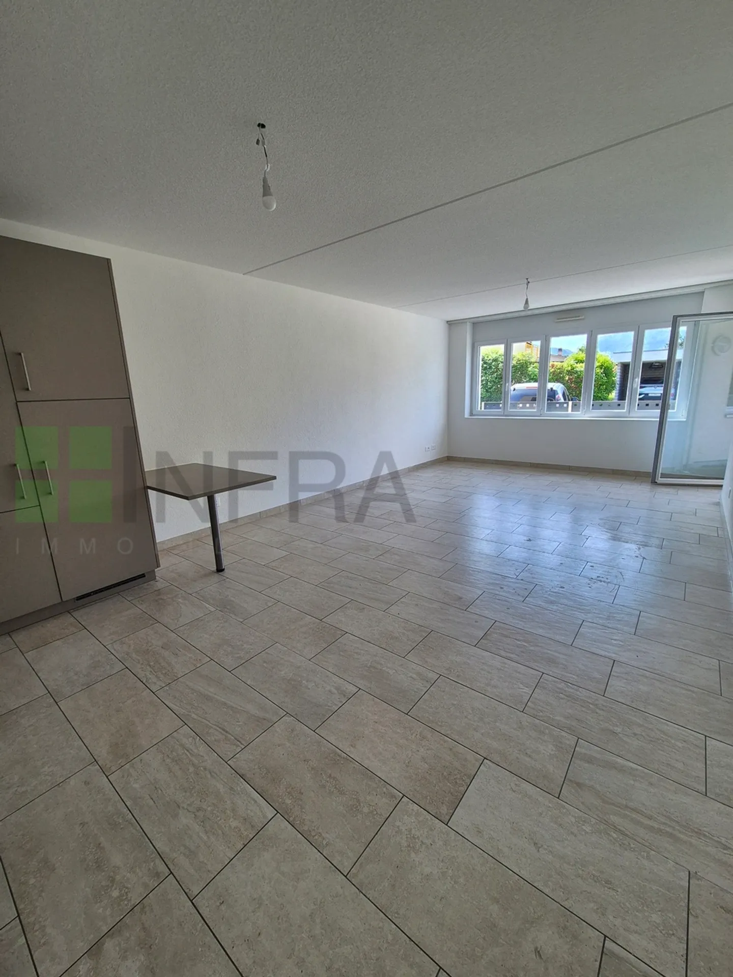 Appartement de 65 m2 au rez-de-chaussée comprenant : Un hall Une cuisine ouverte - Photo 6 sur 7