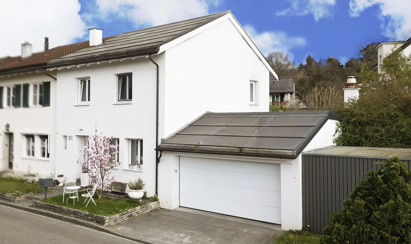 Modernized End Row House with Double Garage, PV System and Generous Garden - Photo 1 of 13