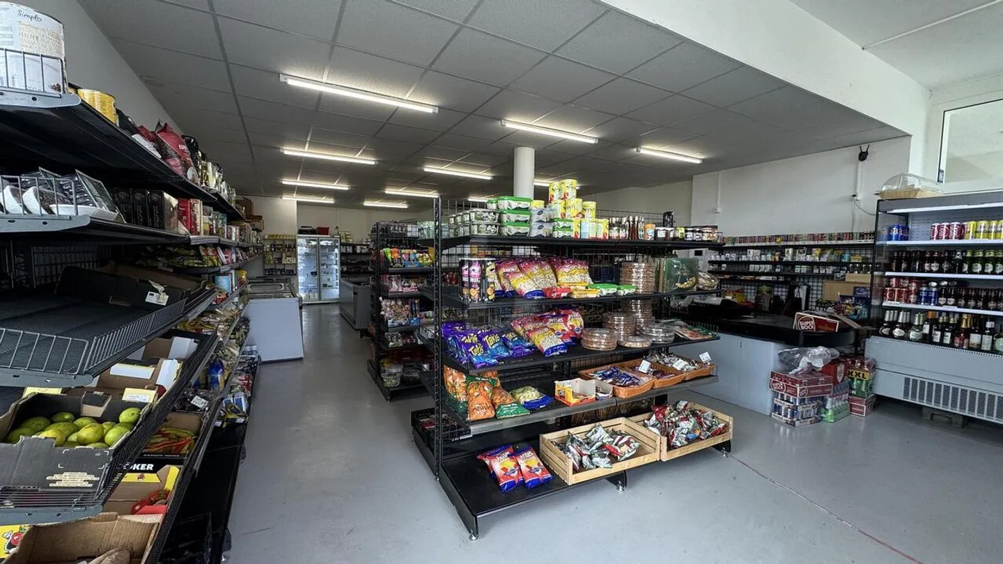 Magasin dans un Nouveau Quartier - Photo 4 sur 5