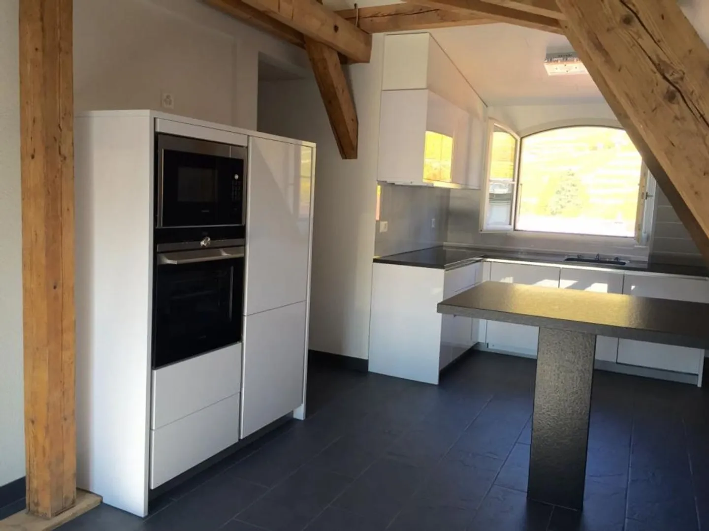 DUPLEX AVEC CHARME AU CENTRE D'AIGLE - Photo 4 sur 7