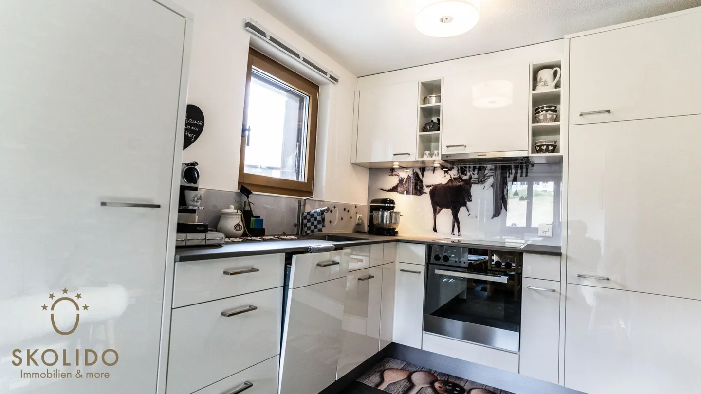 Appartamento ristrutturato di alta qualità con charme alpino in posizione centrale - Foto 7 di 27