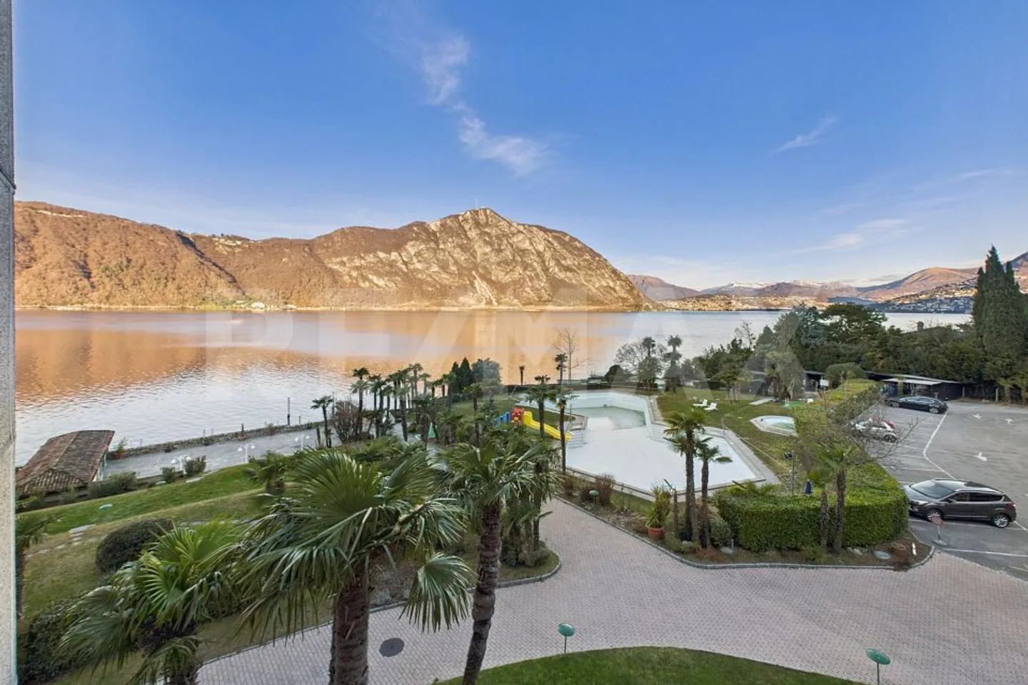 Sensazione di vacanza tutto l'anno, a pochi minuti da Lugano Appartamento 2.5 locali con vista lago e terrazza - Foto 1 di 12