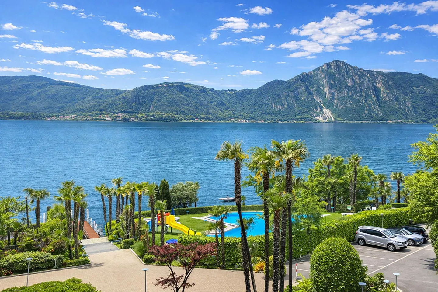 2.5 locali vista lago in residenza con piscina e darsena a Bissone - Photo 1 of 10