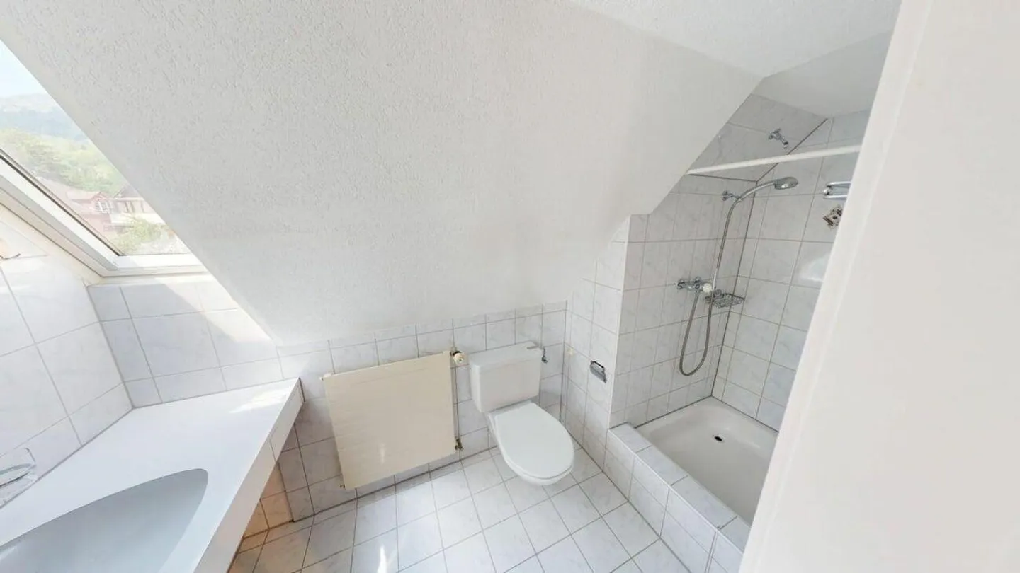 Charmante Dachwohnung - Foto 6 von 7