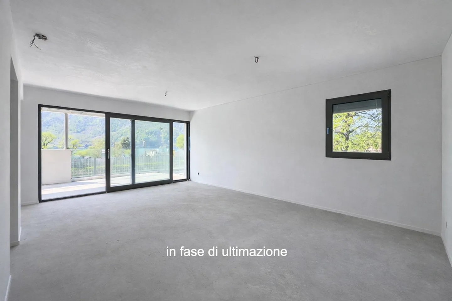 Moderne und neue 3,5-Zimmer-Duplexwohnung mit Garten in Melano - Foto 1 von 7