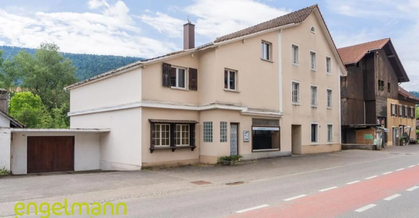 Building with 2 apartments + commercial space - Photo 1 of 10
