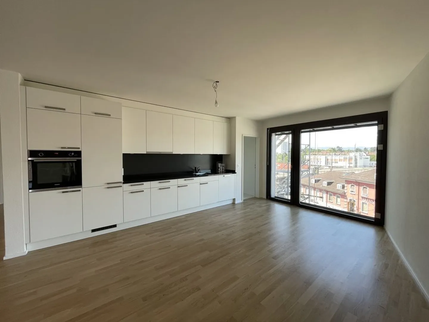 Modern City Apartment: Light, Loggia & Location Above the Rooftops - Photo 3 of 9