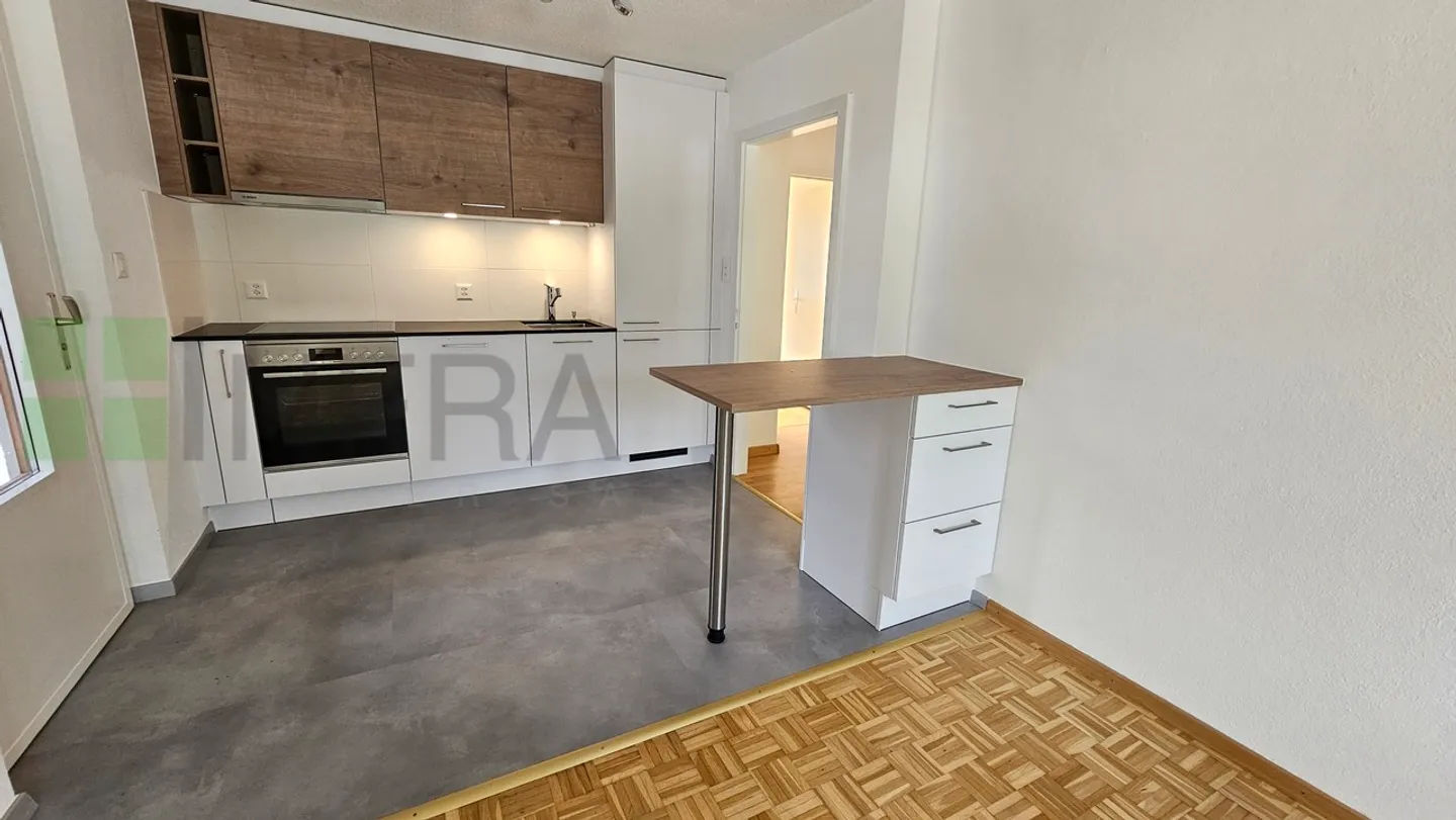 Grand appartement de 2,5 pièces avec garage, buanderie privée et jardin ! - Photo 1 sur 12