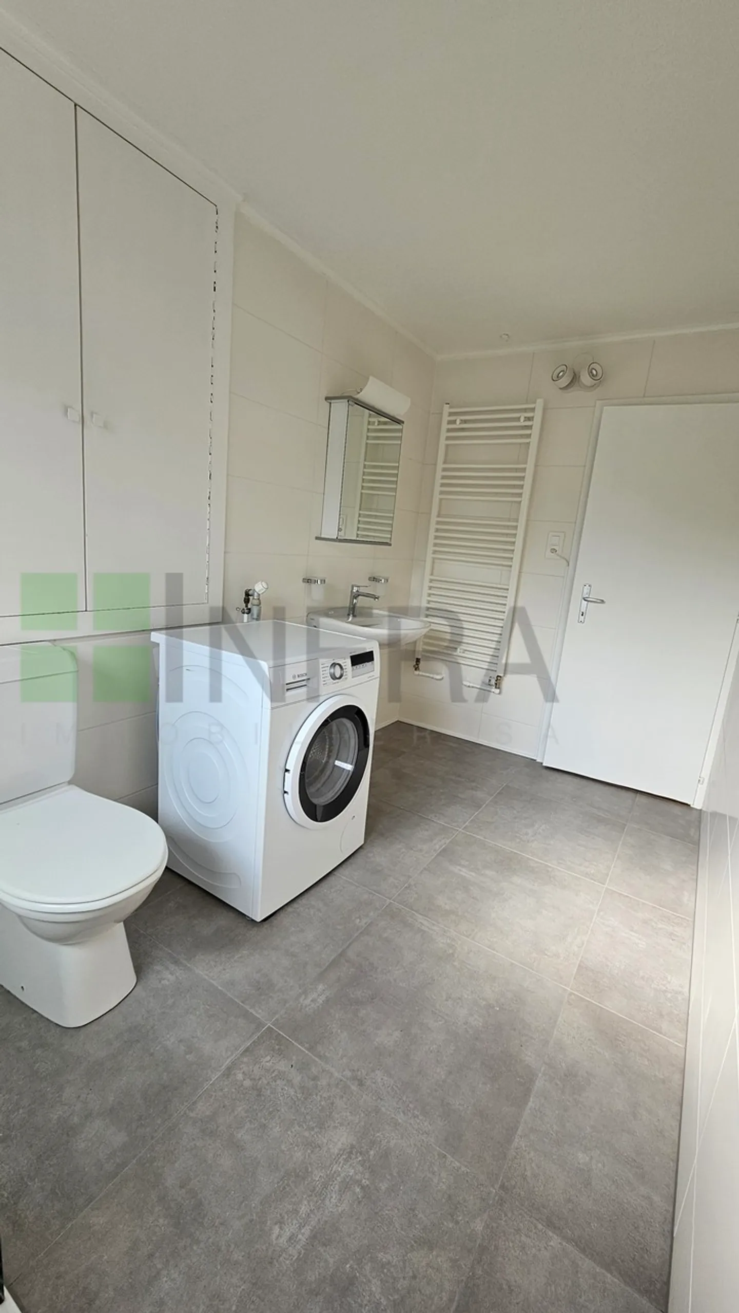 Grand appartement de 2,5 pièces avec garage, buanderie privée et jardin ! - Photo 2 sur 12