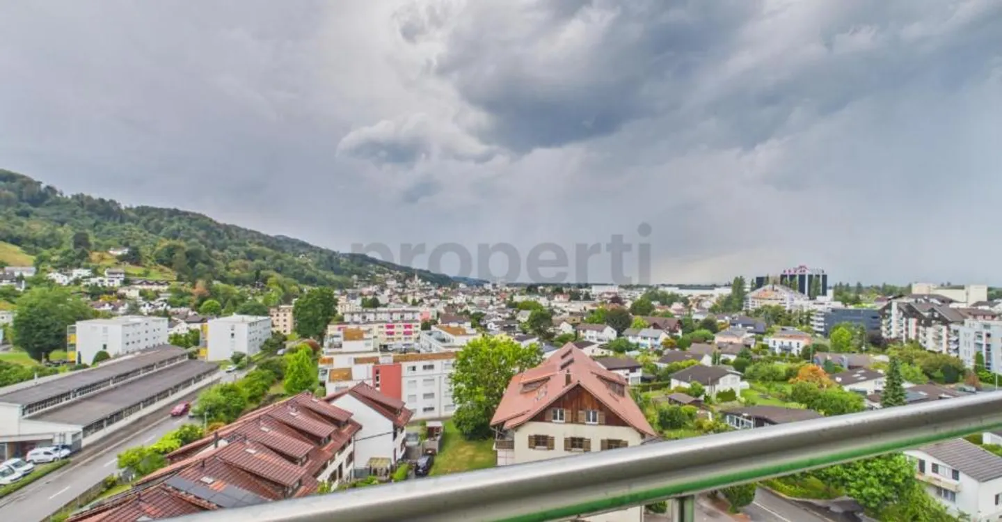 Light-Filled Living with Balcony and Distant View - Photo 1 of 10