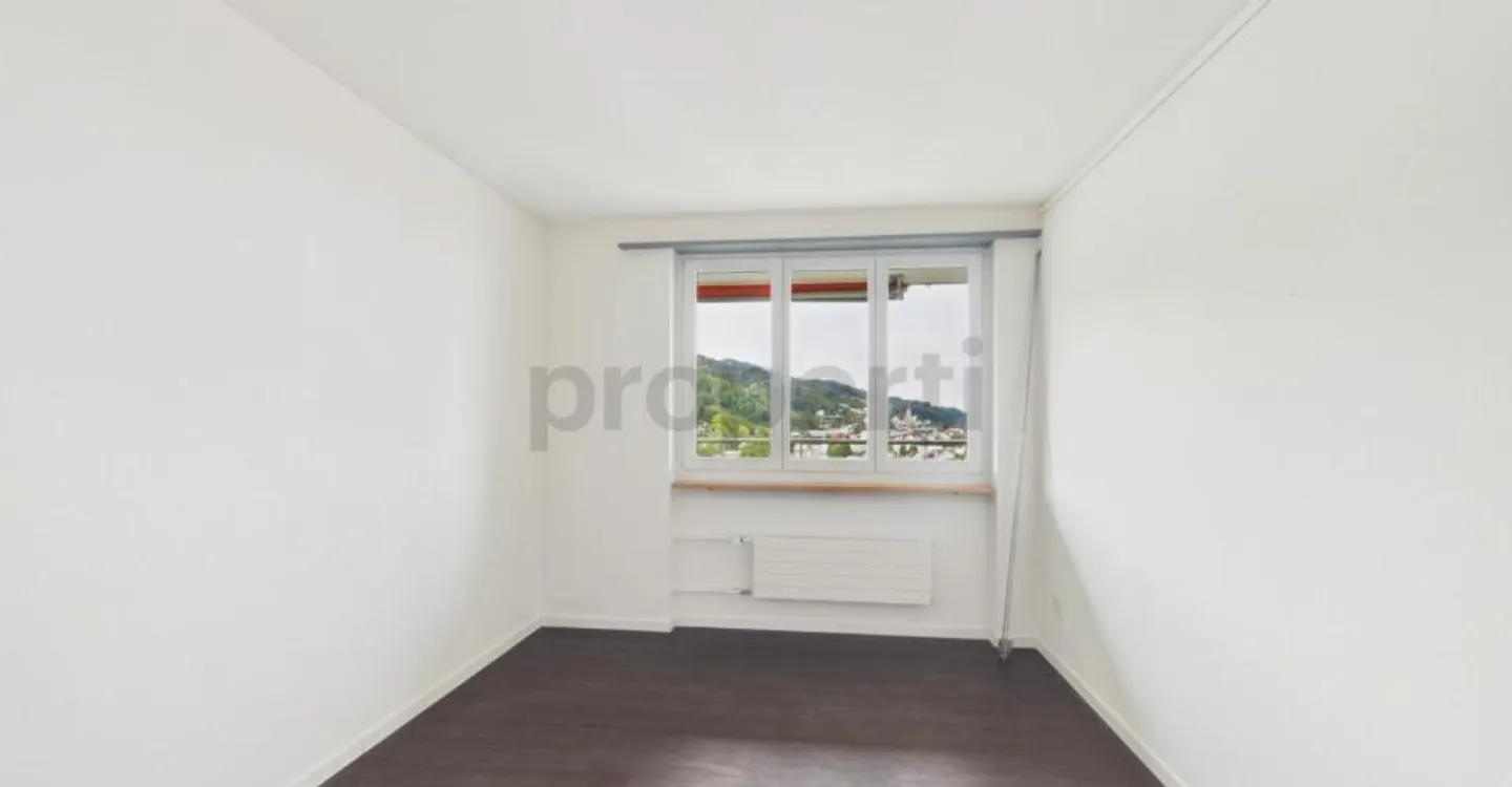 Light-Filled Living with Balcony and Distant View - Photo 8 of 10