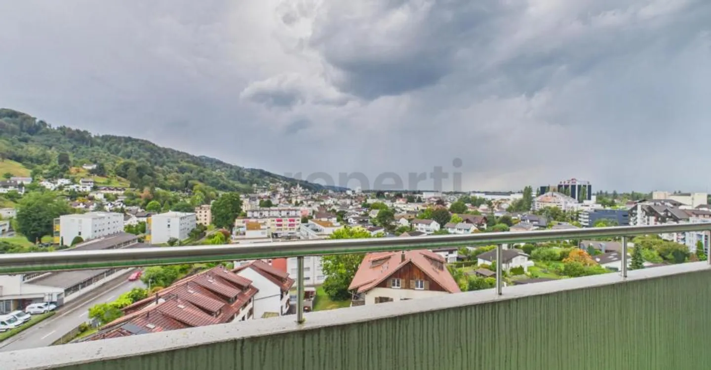 Light-Filled Living with Balcony and Distant View - Photo 9 of 10
