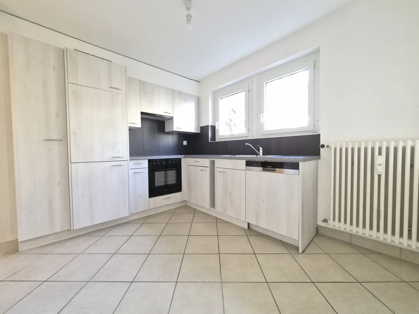 Appartement trois pièces au rez-de-chaussée - Photo 1 sur 10