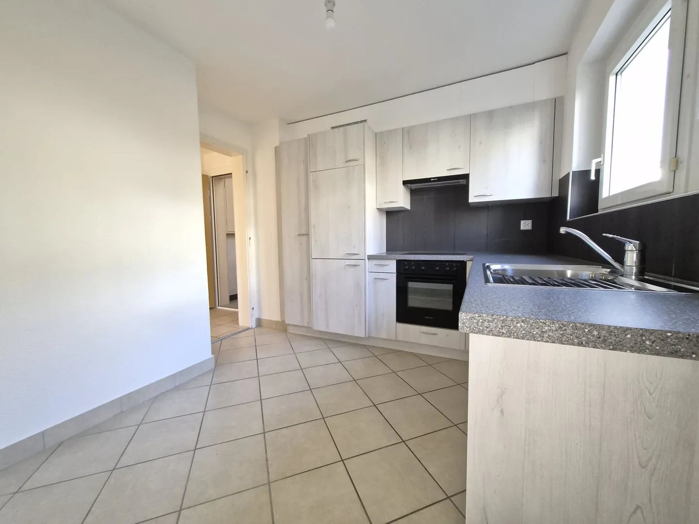 Appartement trois pièces au rez-de-chaussée - Photo 2 sur 10