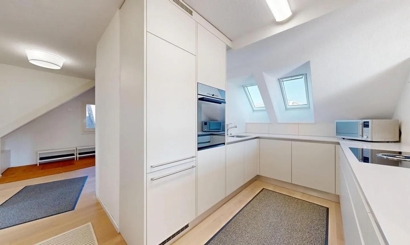 Light-flooded penthouse duplex in a quiet location in Zurich-Witikon - Photo 4 of 11