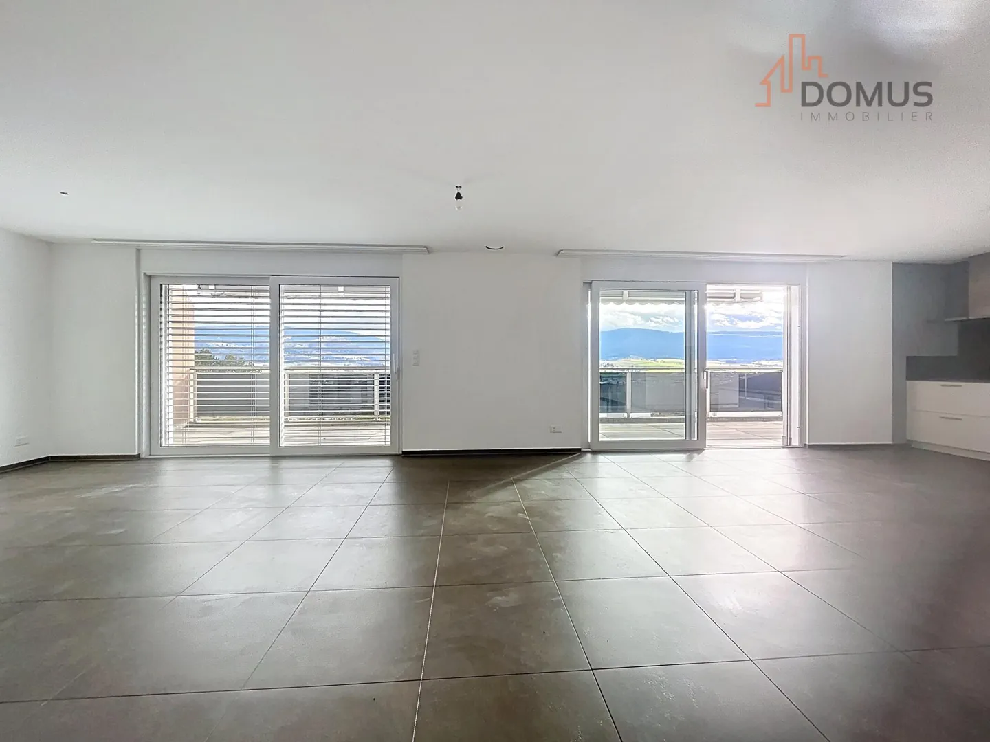 Bright penthouse with 3.5 rooms and a 55 m² panoramic terrace in Delémont - Photo 1 of 13