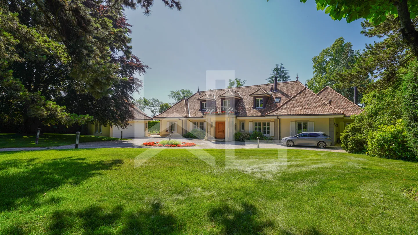 Elegant discreet property by the lake - Photo 1 of 10