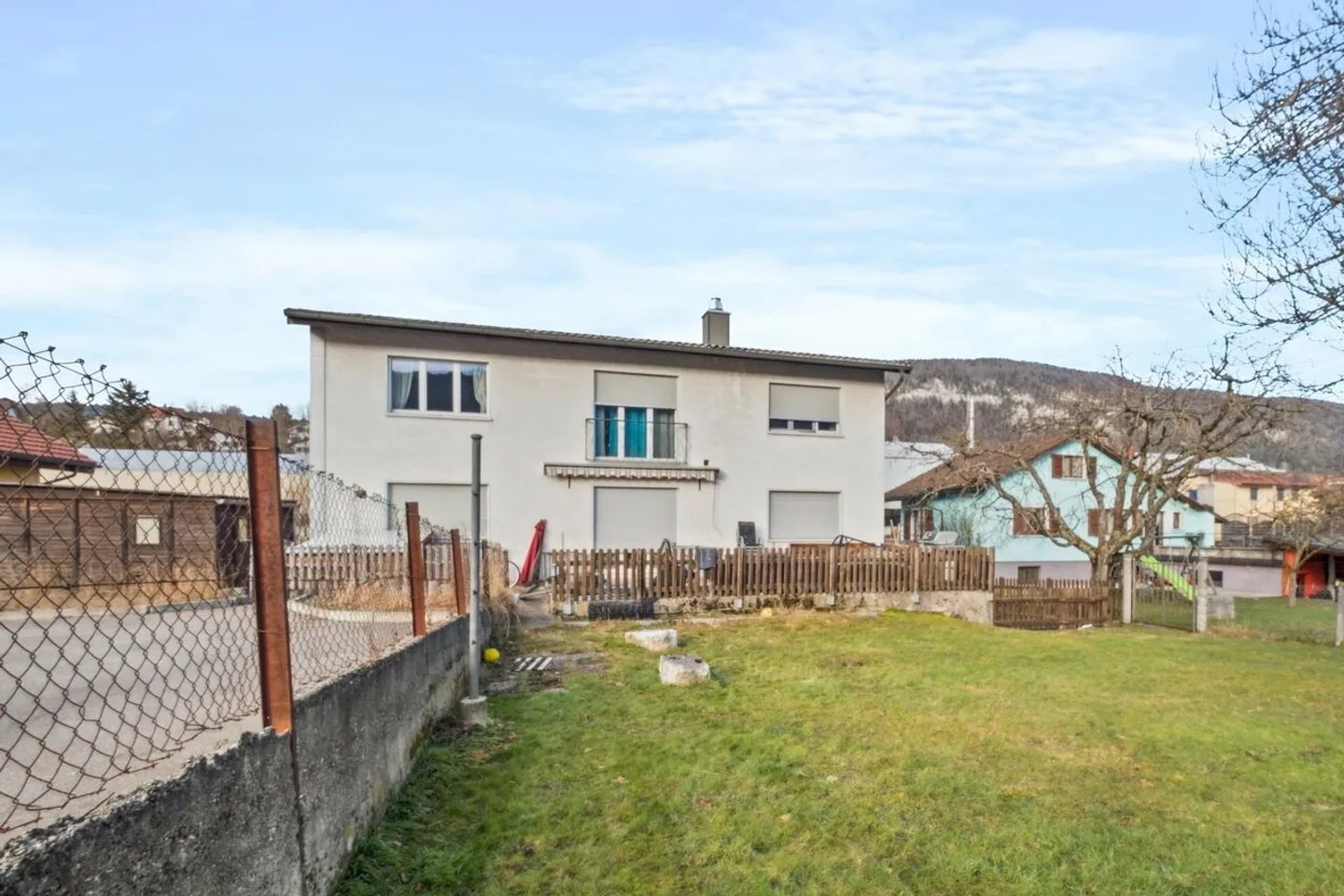 Gebäude mit 2 Wohnungen, 1 Friseursalon, einem Baugrundstück - Foto 13 von 13