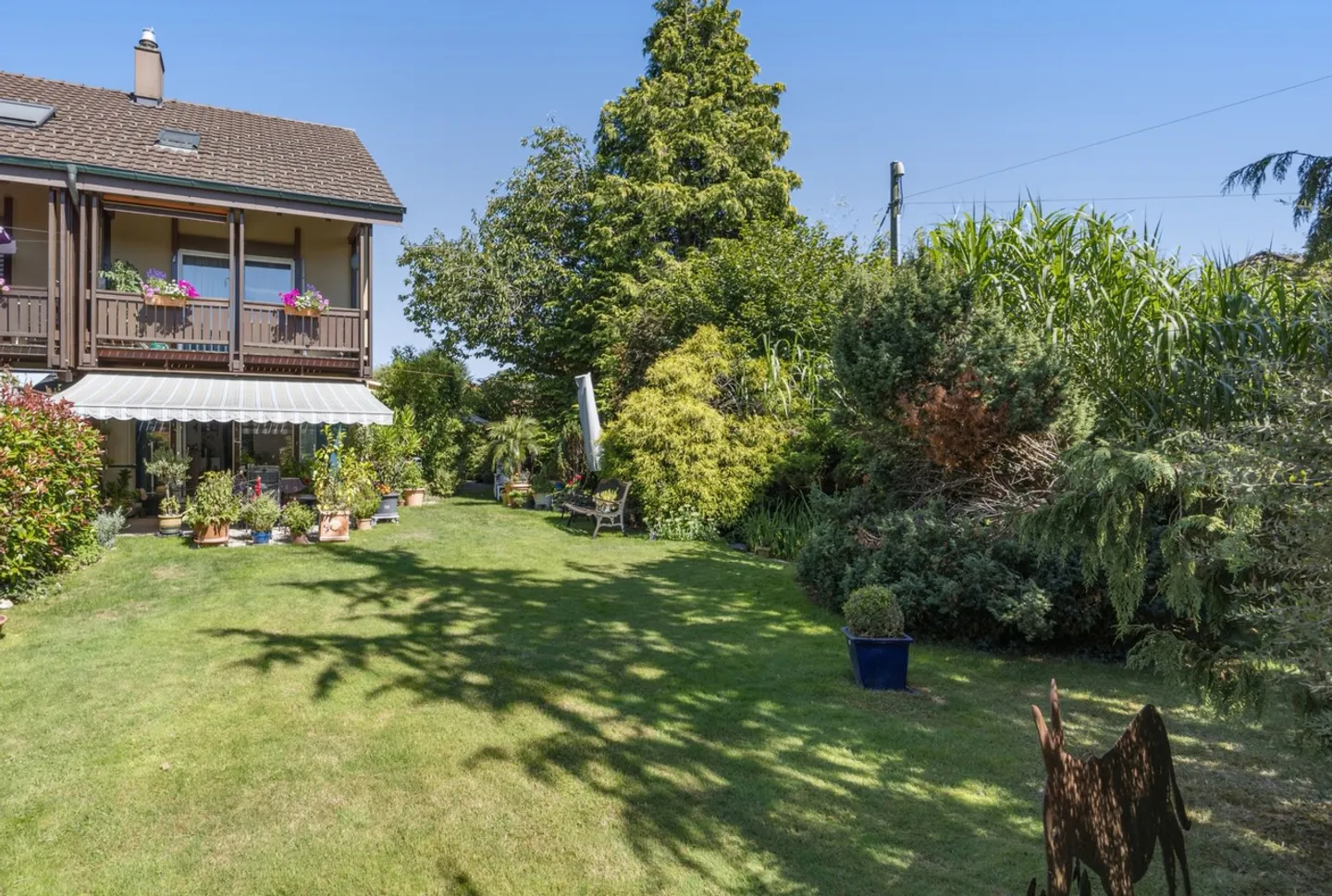 Bellissima casa a schiera con grande giardino e veranda - Foto 1 di 13