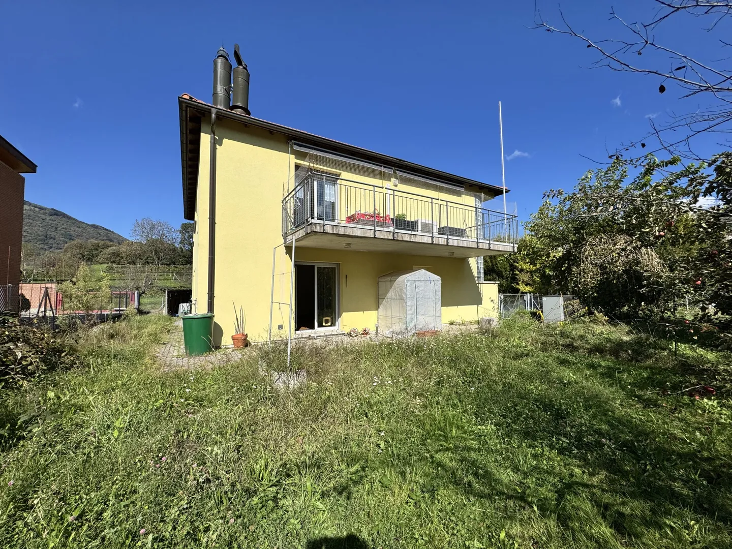 SPACIOUS 3.5 WITH PRIVATE GARDEN IN A TWO-FAMILY HOUSE IN LUGAGGIA - Photo 1 of 10