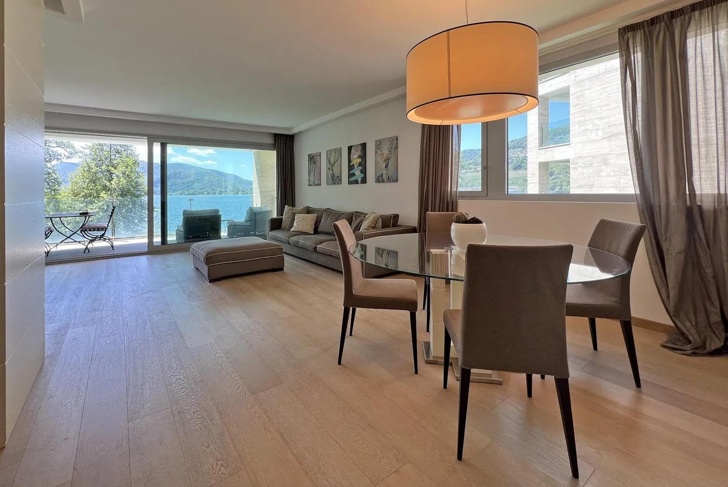 ÉBLOUISSANT ET MODERNE 4.5 AVEC TERRASSE ET VUE SUR LE LAC À MUZZANO - Photo 3 sur 9