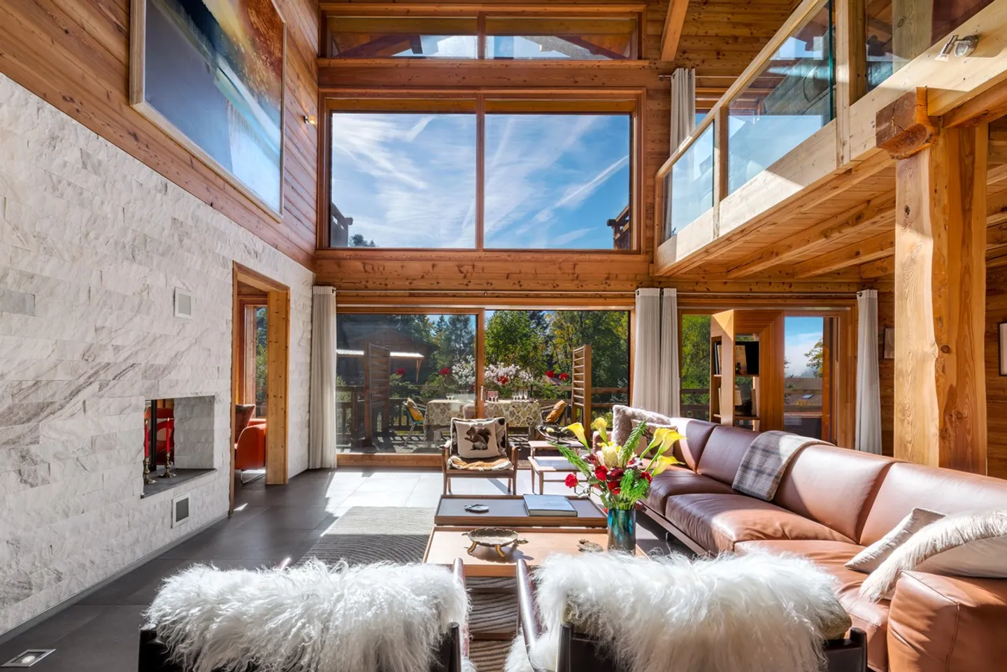 Light-filled Bayrou Chalet for sale in the Villars-sur-Ollon area - cathedral living room, exceptional volumes and perfect continuity between interior and exterior - Photo 1 of 13