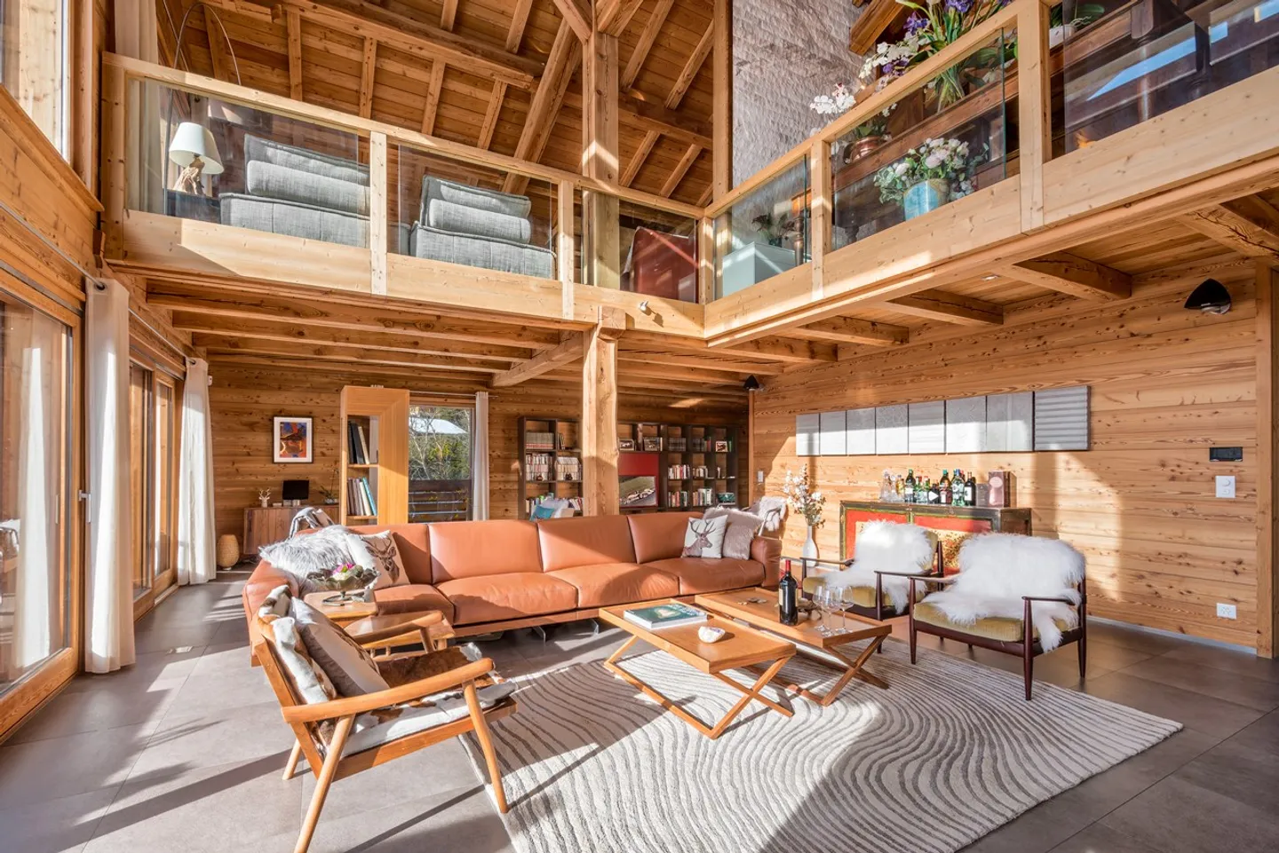 Light-filled Bayrou Chalet for sale in the Villars-sur-Ollon area - cathedral living room, exceptional volumes and perfect continuity between interior and exterior - Photo 7 of 13