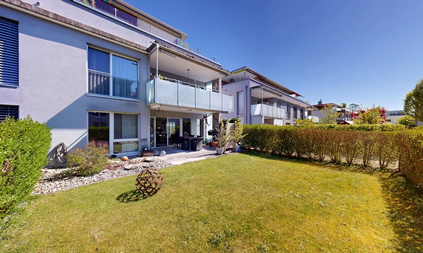 Moderne Gartenwohnung mit Terrasse - Foto 1 von 11