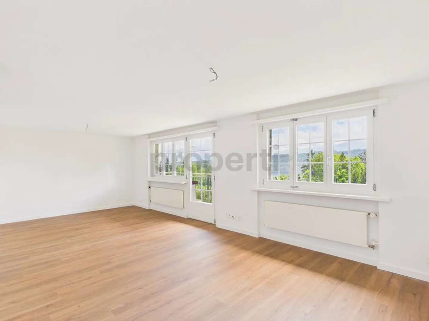 Sogno abitativo sul lago di Zurigo: Maisonette esclusiva con vista lago e giardino privato - Foto 1 di 12