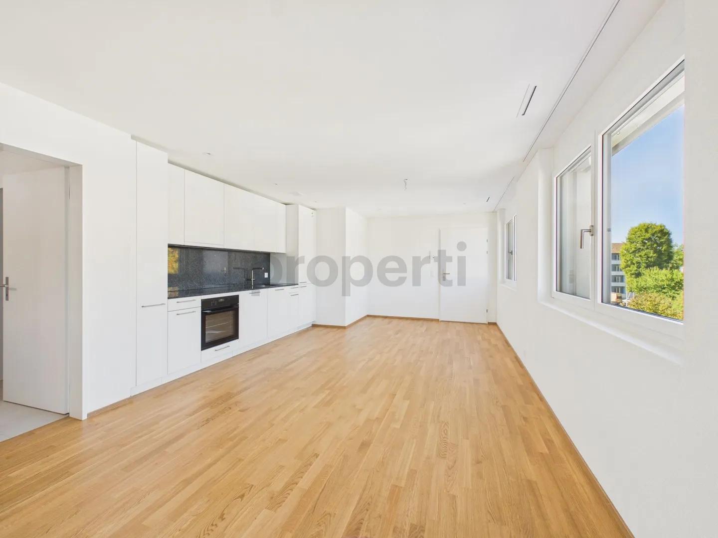 Balcon ensoleillé, standard Minergie, ascenseur et connexion parfaite aux transports en commun ! - Photo 2 sur 7