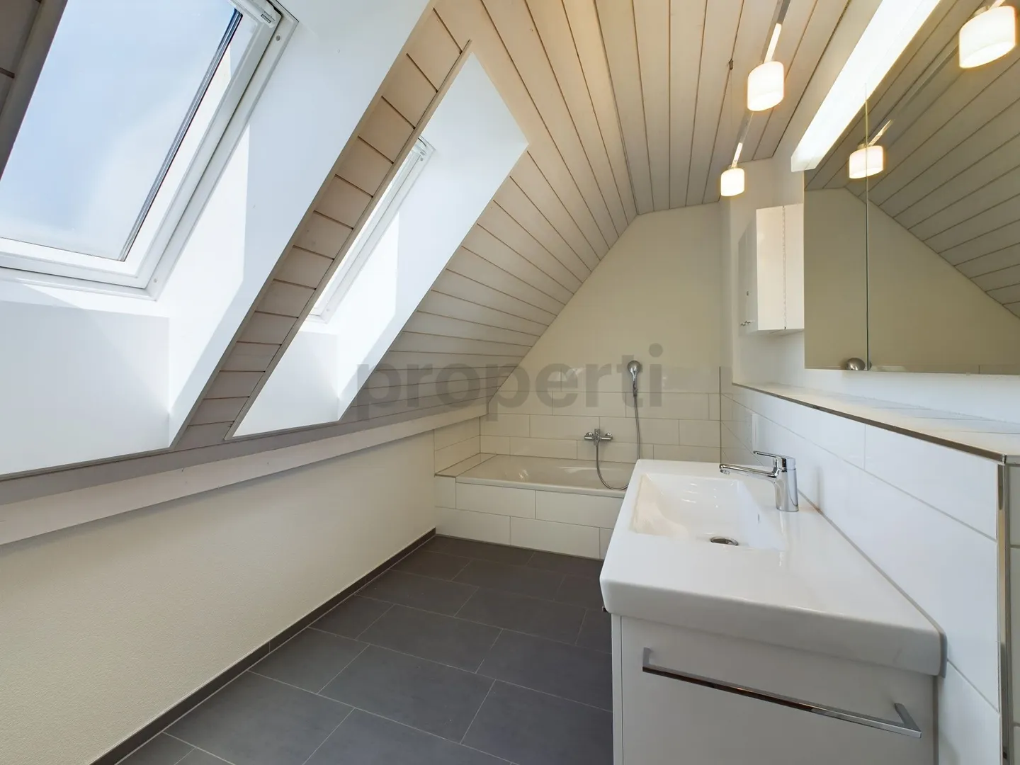Stylish and Cozy 3.5-Room Attic Apartment with Fireplace in Niederglatt - Photo 7 of 11