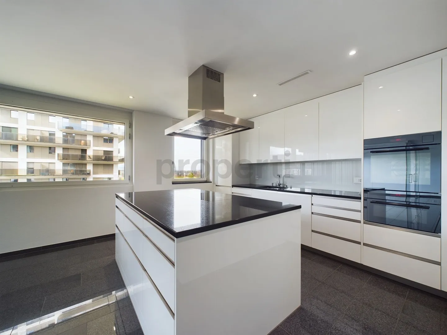 6th floor with impressive views, Minergie standard and modern kitchen - Photo 2 of 11